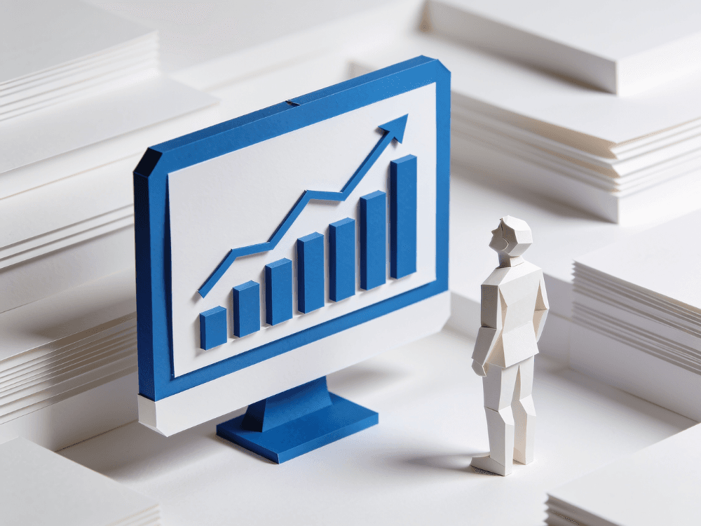 Papercraft figure watching a monitor with a rising bar chart