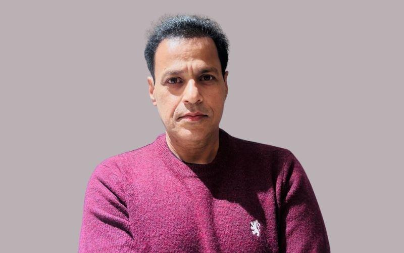 Portrait of a business professional featured in a client testimonial about transparent access to fractional U.S. real estate investing