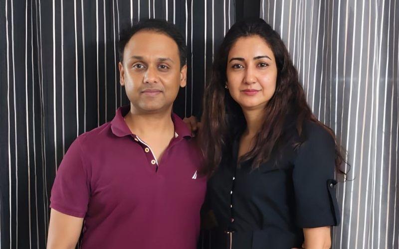 Couple standing together in a portrait photo, featured in a client testimonial about clarity and transparency in U.S. real estate investing